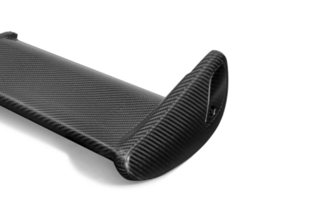 Detailed side view of MUSE Dry Carbon Main Wing endplate for Skyline GT-R BNR34, highlighting matte carbon fiber construction.