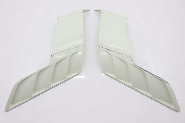 Pair of side skirt fins from VEILSIDE Aero Kit for FFZ400 RZ34, enhancing side profile and aerodynamics.