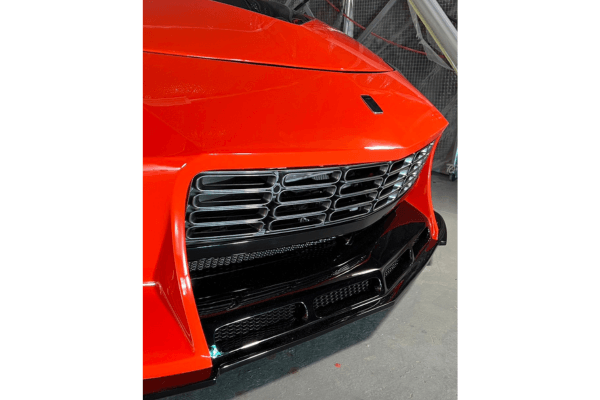 Detailed view of the front grille and bumper design from VEILSIDE Aero Kit for FFZ400 RZ34, emphasizing airflow and styling.