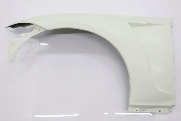 Passenger side front fender from VEILSIDE Aero Kit for FFZ400 RZ34, showcasing widebody design in raw finish.