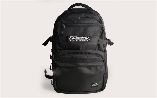 GREDDY Backpack 45L in black polyester with front logo patch, multiple compartments, and durable zippers for everyday and travel use.