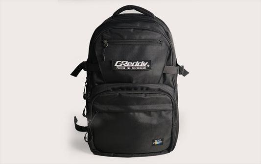 GREDDY Backpack 45L in black polyester with front logo patch, multiple compartments, and durable zippers for everyday and travel use.