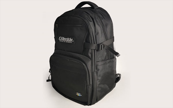 Side view of GREDDY Backpack 45L showing adjustable straps, side pockets, and rugged polyester build ideal for accessories and gear.