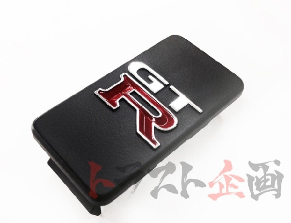 OEM Nissan Center Console Emblem - BCNR33 #663111106 - Trust Kikaku