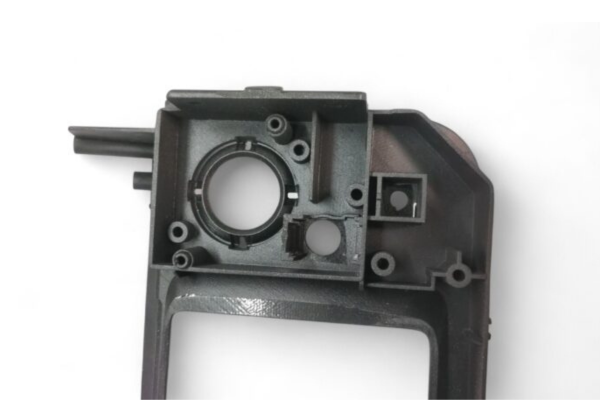 Detailed internal structure of GRID RACING MFD Front Panel Finisher for Skyline BNR34 GTR, showing precision molding and component housing.