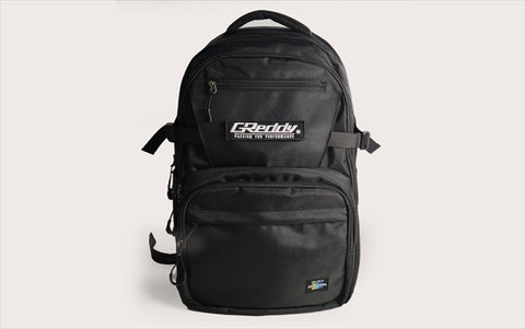 GREDDY Backpack 45L in black polyester with front logo patch, multiple compartments, and durable zippers for everyday and travel use.