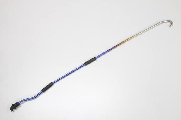 Curved FUJITSUBO EXH+ Hood Support rod for Fairlady Z RZ34, featuring resin holder and titanium construction with blue to gold gradient finish.