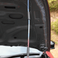 Close-up of FUJITSUBO EXH+ Hood Support installed on Fairlady Z RZ34, highlighting titanium build and burnt color gradation under hood.