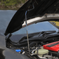 Side view of FUJITSUBO EXH+ Hood Support holding up the hood of a Civic Type R FK8, highlighting its titanium build and fitment.