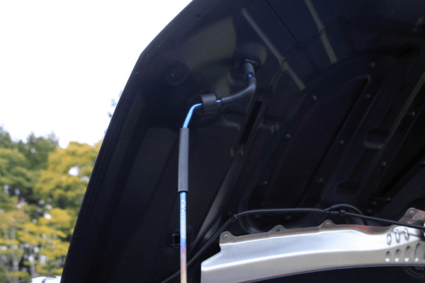 Top mount of FUJITSUBO EXH+ Hood Support attached to hood of Civic Type R FK8, showing secure installation and design.