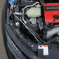 Engine bay of Civic Type R FK8 with FUJITSUBO EXH+ Hood Support installed, emphasizing lightweight titanium construction.