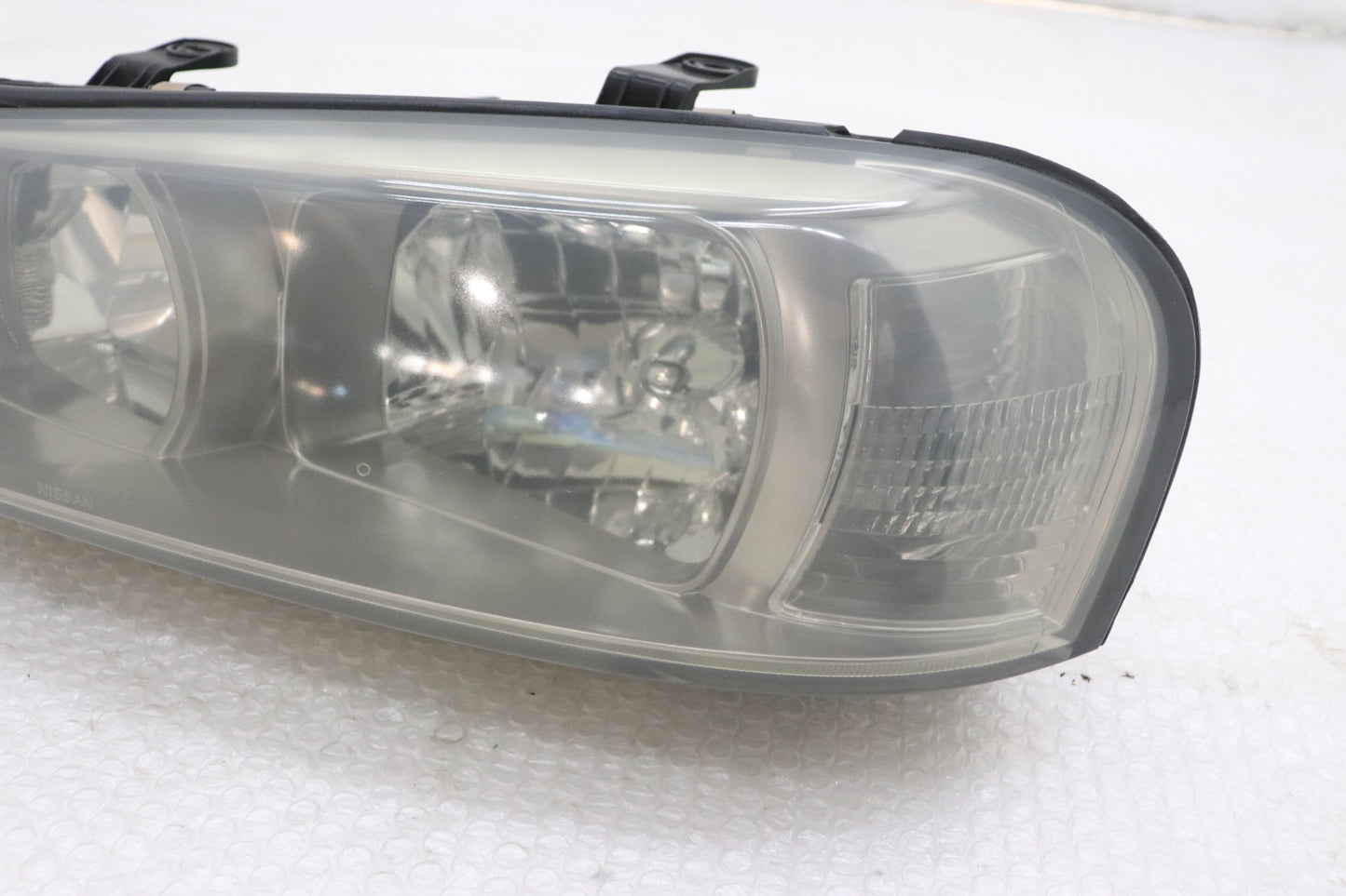 [USED] NISSAN Halogen Headlight (Passenger Side) – Skyline ER34 25GT Turbo (Late Model) 4-Door #1100333112